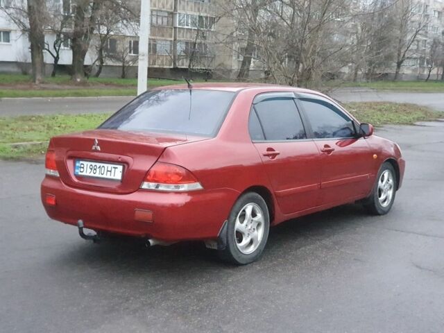 Красный Мицубиси Лансер, объемом двигателя 1.6 л и пробегом 250 тыс. км за 3700 $, фото 4 на Automoto.ua