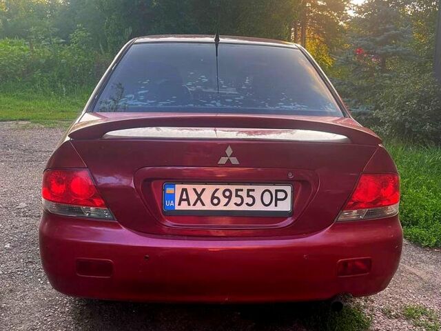 Червоний Міцубісі Lancer, об'ємом двигуна 1.6 л та пробігом 185 тис. км за 3900 $, фото 3 на Automoto.ua