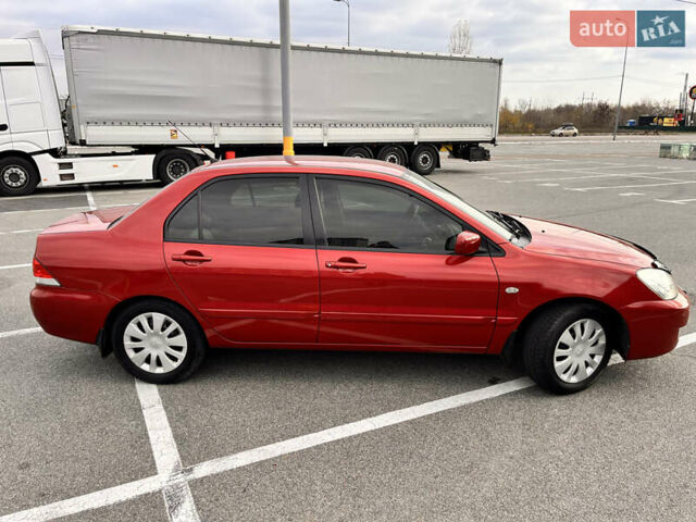 Червоний Міцубісі Lancer, об'ємом двигуна 1.6 л та пробігом 194 тис. км за 5500 $, фото 2 на Automoto.ua