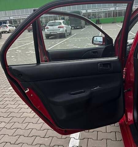 Красный Мицубиси Лансер, объемом двигателя 1.6 л и пробегом 176 тыс. км за 4300 $, фото 22 на Automoto.ua