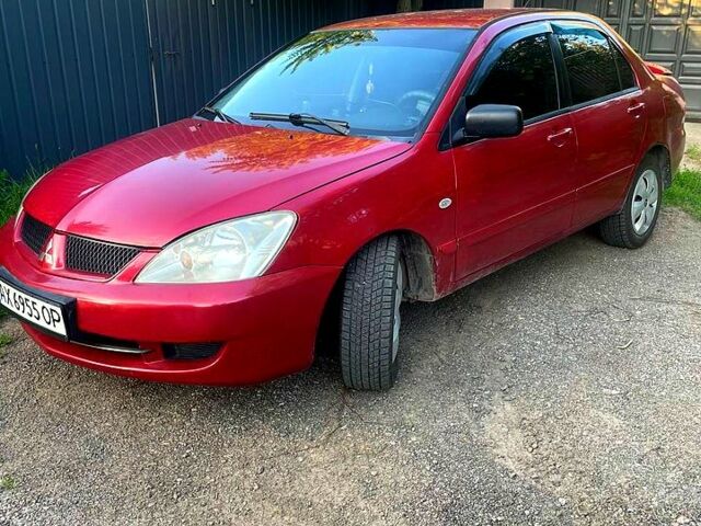Червоний Міцубісі Lancer, об'ємом двигуна 1.6 л та пробігом 185 тис. км за 3900 $, фото 4 на Automoto.ua