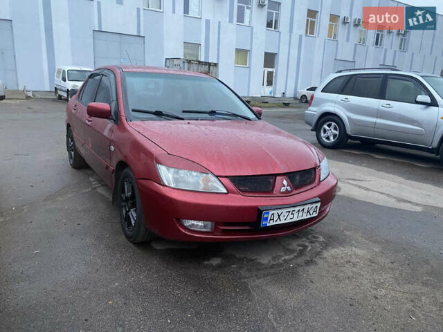 Красный Мицубиси Лансер, объемом двигателя 1.58 л и пробегом 269 тыс. км за 3899 $, фото 1 на Automoto.ua