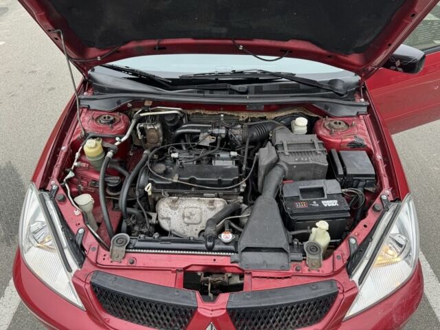 Красный Мицубиси Лансер, объемом двигателя 1.6 л и пробегом 285 тыс. км за 3650 $, фото 15 на Automoto.ua