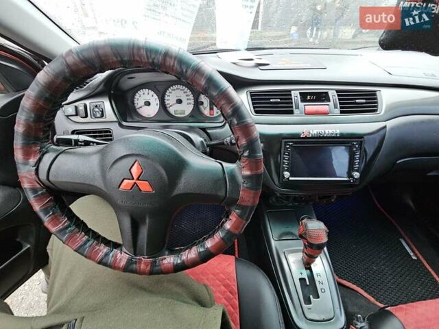 Червоний Міцубісі Lancer, об'ємом двигуна 1.6 л та пробігом 267 тис. км за 2999 $, фото 14 на Automoto.ua