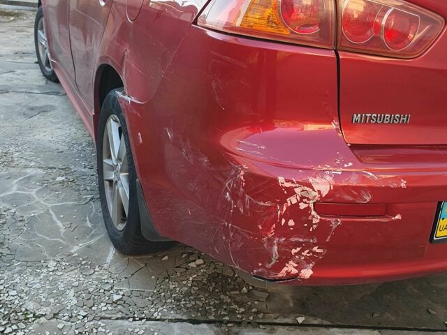 Красный Мицубиси Лансер, объемом двигателя 2 л и пробегом 406 тыс. км за 2750 $, фото 7 на Automoto.ua