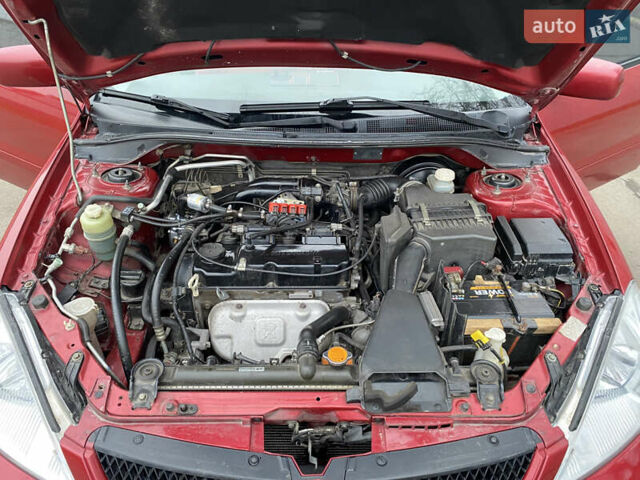 Червоний Міцубісі Lancer, об'ємом двигуна 1.58 л та пробігом 151 тис. км за 5600 $, фото 16 на Automoto.ua