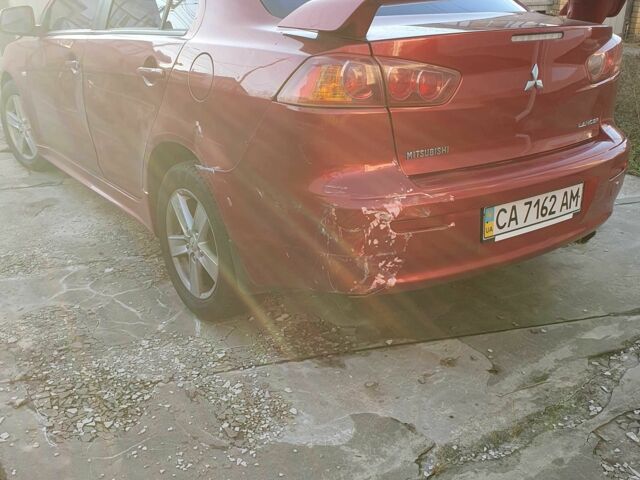 Красный Мицубиси Лансер, объемом двигателя 2 л и пробегом 406 тыс. км за 2750 $, фото 6 на Automoto.ua