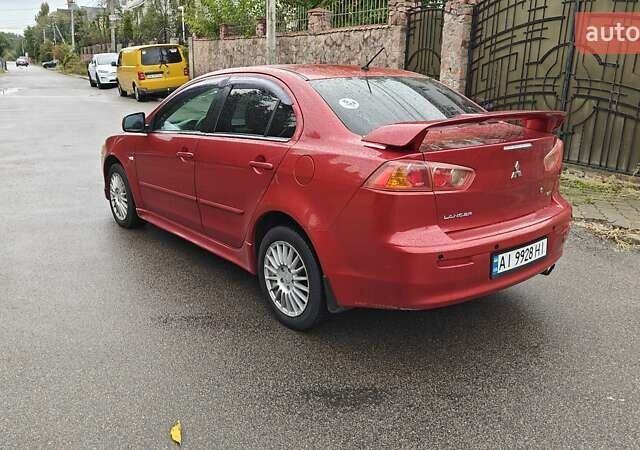 Червоний Міцубісі Lancer, об'ємом двигуна 2 л та пробігом 186 тис. км за 5600 $, фото 9 на Automoto.ua