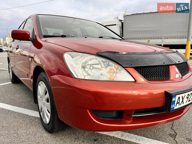 Червоний Міцубісі Lancer, об'ємом двигуна 1.6 л та пробігом 194 тис. км за 5500 $, фото 14 на Automoto.ua