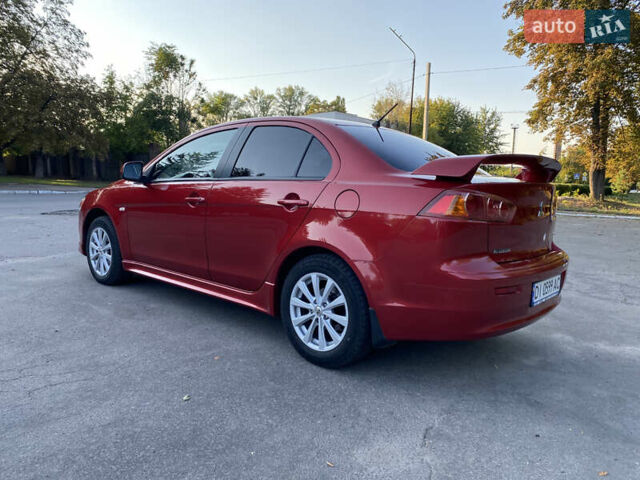 Червоний Міцубісі Lancer, об'ємом двигуна 2 л та пробігом 153 тис. км за 6700 $, фото 1 на Automoto.ua