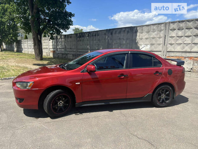 Червоний Міцубісі Lancer, об'ємом двигуна 2 л та пробігом 291 тис. км за 5200 $, фото 1 на Automoto.ua