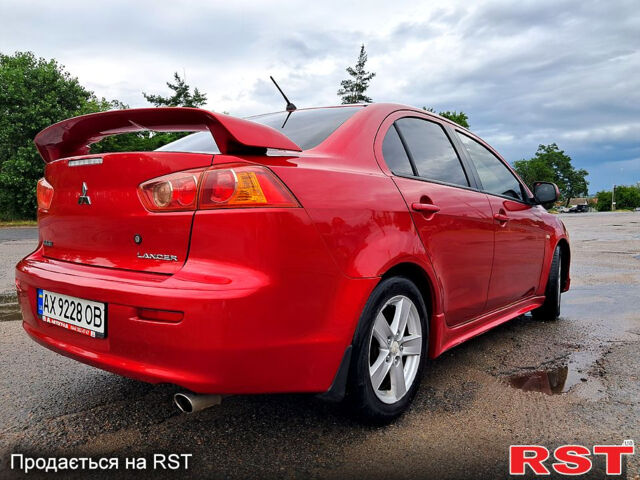 Червоний Міцубісі Lancer, об'ємом двигуна 2 л та пробігом 187 тис. км за 5000 $, фото 2 на Automoto.ua