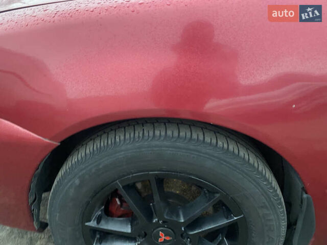 Красный Мицубиси Лансер, объемом двигателя 1.58 л и пробегом 269 тыс. км за 3899 $, фото 10 на Automoto.ua