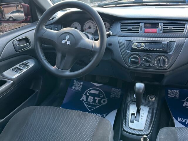 Красный Мицубиси Лансер, объемом двигателя 1.6 л и пробегом 230 тыс. км за 5300 $, фото 6 на Automoto.ua