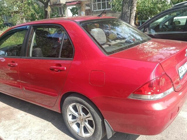 Красный Мицубиси Лансер, объемом двигателя 0 л и пробегом 221 тыс. км за 5500 $, фото 2 на Automoto.ua