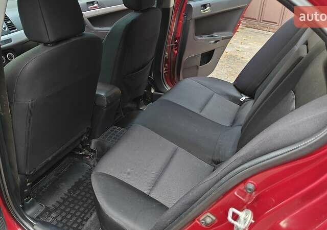 Міцубісі Lancer 2007 у Києві на Automoto.ua Червоний Міцубісі Lancer, об'ємом двигуна 2 л та пробігом 186 тис. км за 5600 $, фото 26 на Automoto.ua