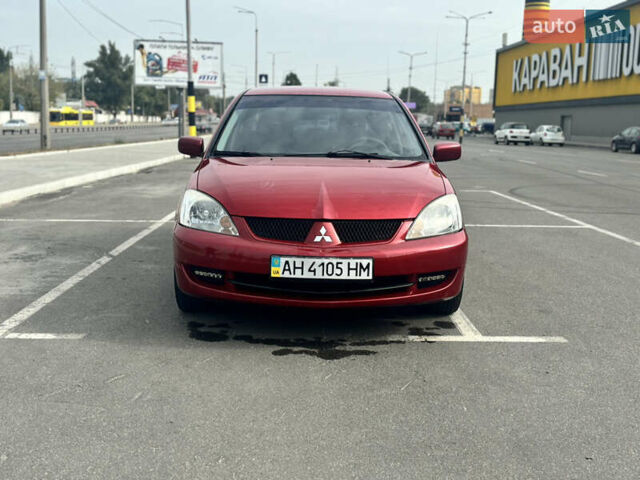 Красный Мицубиси Лансер, объемом двигателя 1.6 л и пробегом 114 тыс. км за 5200 $, фото 2 на Automoto.ua