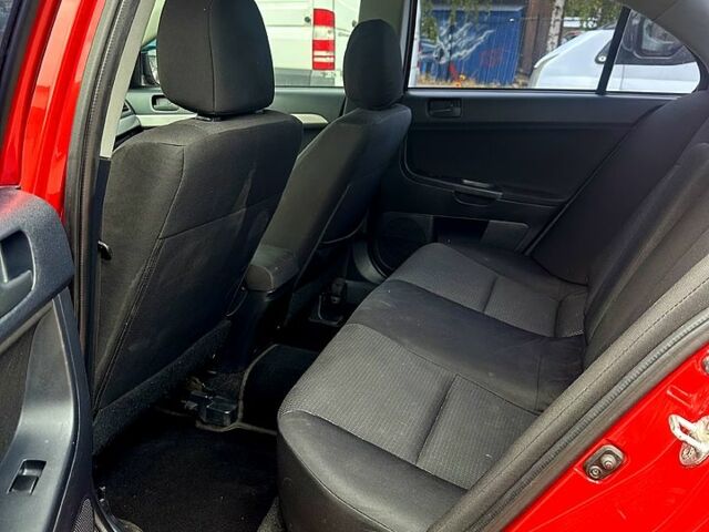 Червоний Міцубісі Lancer, об'ємом двигуна 2 л та пробігом 184 тис. км за 5999 $, фото 6 на Automoto.ua