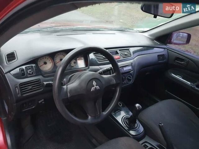 Красный Мицубиси Лансер, объемом двигателя 1.6 л и пробегом 250 тыс. км за 3700 $, фото 7 на Automoto.ua