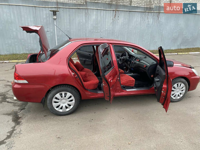 Червоний Міцубісі Lancer, об'ємом двигуна 1.58 л та пробігом 151 тис. км за 5600 $, фото 17 на Automoto.ua