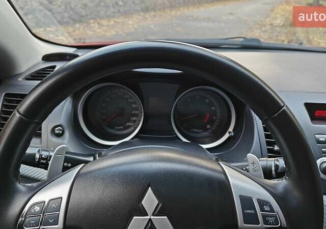 Красный Мицубиси Лансер, объемом двигателя 2 л и пробегом 186 тыс. км за 5600 $, фото 23 на Automoto.ua