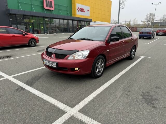 Красный Мицубиси Лансер, объемом двигателя 1.6 л и пробегом 285 тыс. км за 3650 $, фото 2 на Automoto.ua