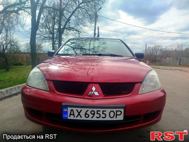 Красный Мицубиси Лансер, объемом двигателя 1.6 л и пробегом 174 тыс. км за 4700 $, фото 1 на Automoto.ua
