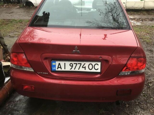 Червоний Міцубісі Lancer, об'ємом двигуна 1.6 л та пробігом 286 тис. км за 3450 $, фото 1 на Automoto.ua