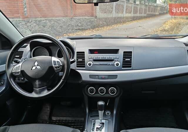 Червоний Міцубісі Lancer, об'ємом двигуна 2 л та пробігом 187 тис. км за 5500 $, фото 26 на Automoto.ua