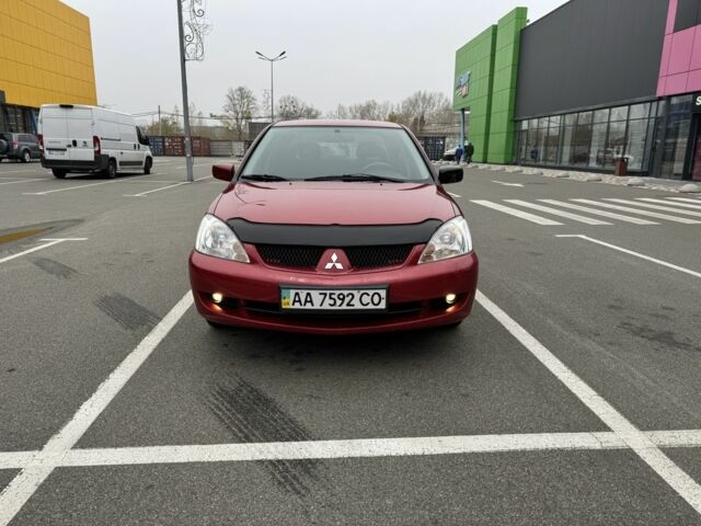 Красный Мицубиси Лансер, объемом двигателя 1.6 л и пробегом 285 тыс. км за 3650 $, фото 3 на Automoto.ua