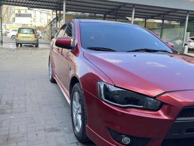 Красный Мицубиси Лансер, объемом двигателя 2 л и пробегом 267 тыс. км за 7000 $, фото 2 на Automoto.ua