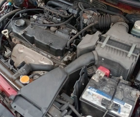 Красный Мицубиси Лансер, объемом двигателя 1.6 л и пробегом 155 тыс. км за 2000 $, фото 2 на Automoto.ua