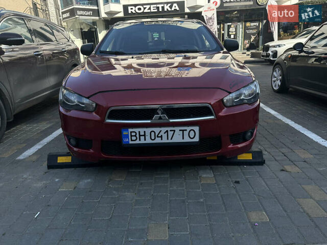 Красный Мицубиси Лансер, объемом двигателя 2 л и пробегом 262 тыс. км за 6000 $, фото 3 на Automoto.ua