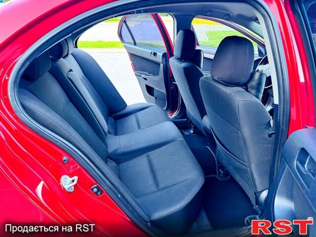Красный Мицубиси Лансер, объемом двигателя 2 л и пробегом 180 тыс. км за 6500 $, фото 7 на Automoto.ua