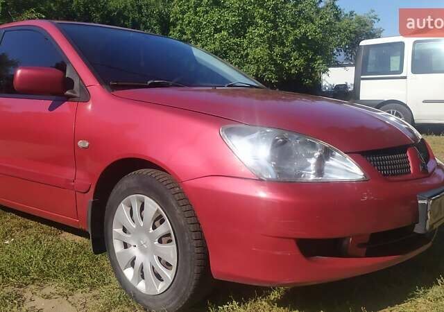 Червоний Міцубісі Lancer, об'ємом двигуна 1.58 л та пробігом 280 тис. км за 4300 $, фото 10 на Automoto.ua