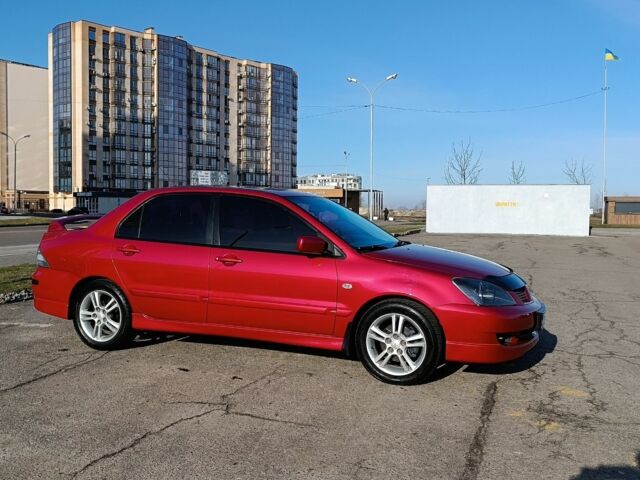 Червоний Міцубісі Lancer, об'ємом двигуна 2 л та пробігом 163 тис. км за 5500 $, фото 4 на Automoto.ua