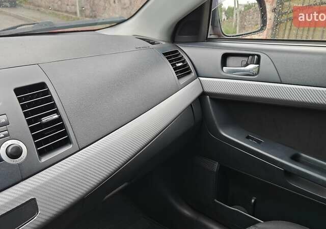 Червоний Міцубісі Lancer, об'ємом двигуна 2 л та пробігом 186 тис. км за 5600 $, фото 13 на Automoto.ua