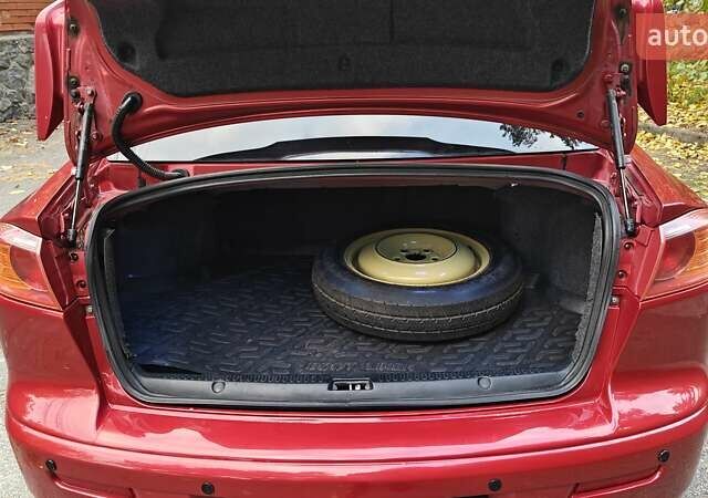Червоний Міцубісі Lancer, об'ємом двигуна 2 л та пробігом 187 тис. км за 5500 $, фото 29 на Automoto.ua