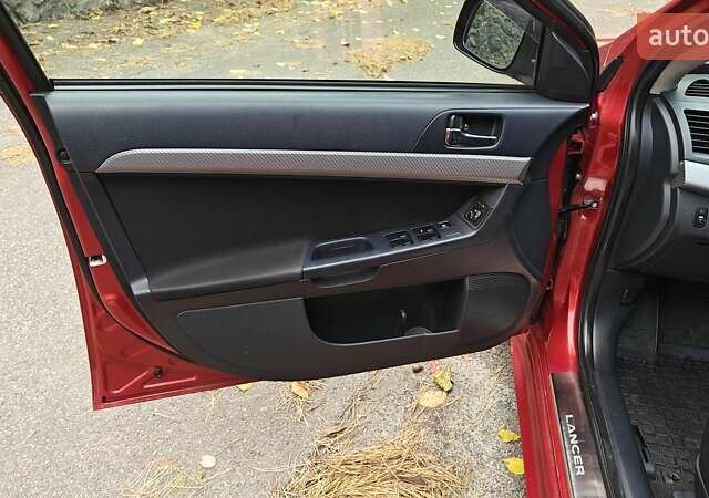 Червоний Міцубісі Lancer, об'ємом двигуна 2 л та пробігом 187 тис. км за 5500 $, фото 21 на Automoto.ua