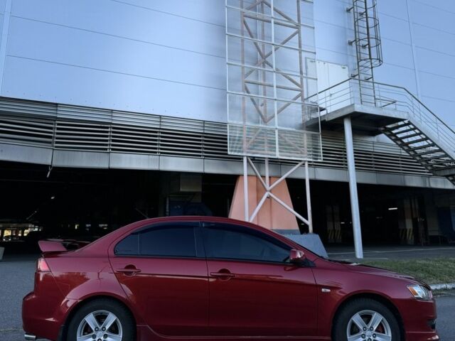 Красный Мицубиси Лансер, объемом двигателя 2 л и пробегом 307 тыс. км за 6499 $, фото 3 на Automoto.ua