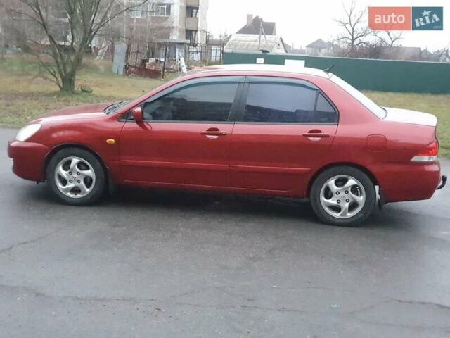 Красный Мицубиси Лансер, объемом двигателя 1.6 л и пробегом 250 тыс. км за 3700 $, фото 6 на Automoto.ua