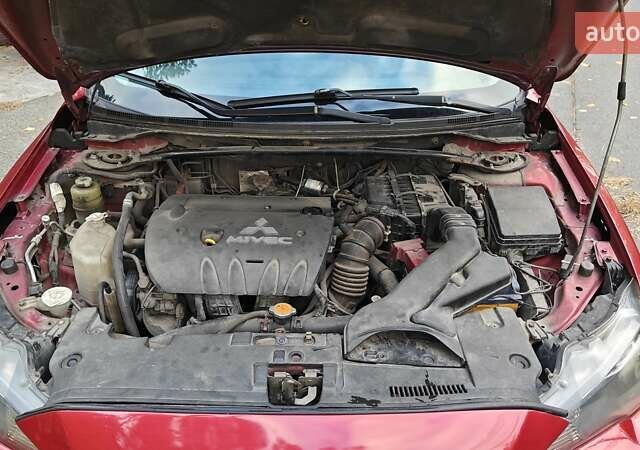 Червоний Міцубісі Lancer, об'ємом двигуна 2 л та пробігом 187 тис. км за 5500 $, фото 31 на Automoto.ua