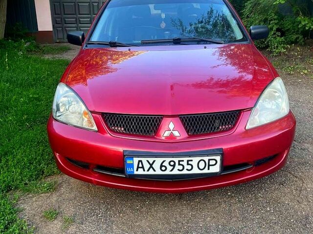 Червоний Міцубісі Lancer, об'ємом двигуна 1.6 л та пробігом 185 тис. км за 3900 $, фото 5 на Automoto.ua