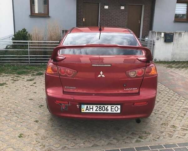 Красный Мицубиси Лансер, объемом двигателя 2 л и пробегом 198 тыс. км за 5700 $, фото 1 на Automoto.ua