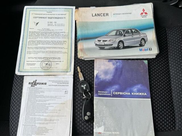 Красный Мицубиси Лансер, объемом двигателя 1.6 л и пробегом 285 тыс. км за 3650 $, фото 16 на Automoto.ua