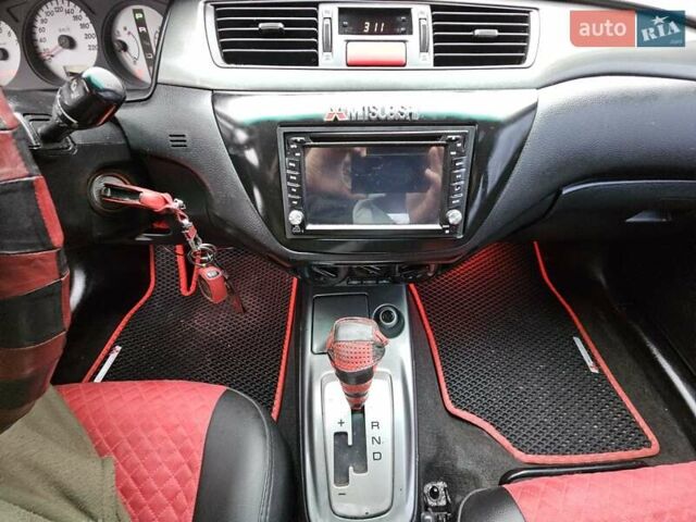 Червоний Міцубісі Lancer, об'ємом двигуна 1.6 л та пробігом 267 тис. км за 2999 $, фото 15 на Automoto.ua