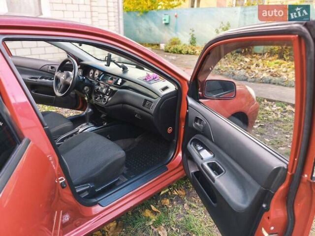 Красный Мицубиси Лансер, объемом двигателя 1.6 л и пробегом 214 тыс. км за 5000 $, фото 3 на Automoto.ua