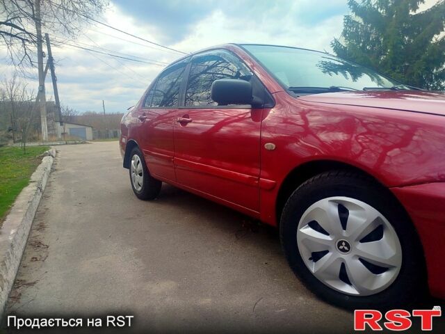 Красный Мицубиси Лансер, объемом двигателя 1.6 л и пробегом 174 тыс. км за 4700 $, фото 3 на Automoto.ua