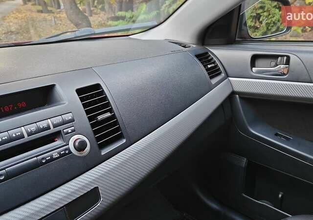 Міцубісі Lancer 2007 у Києві на Automoto.ua Червоний Міцубісі Lancer, об'ємом двигуна 2 л та пробігом 186 тис. км за 5600 $, фото 22 на Automoto.ua