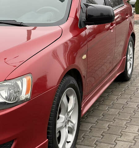 Красный Мицубиси Лансер, объемом двигателя 2 л и пробегом 261 тыс. км за 7200 $, фото 2 на Automoto.ua